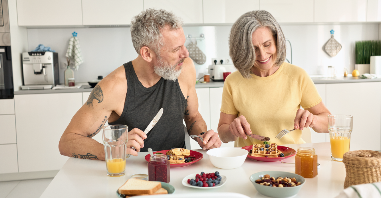 Older couple making breakfast together